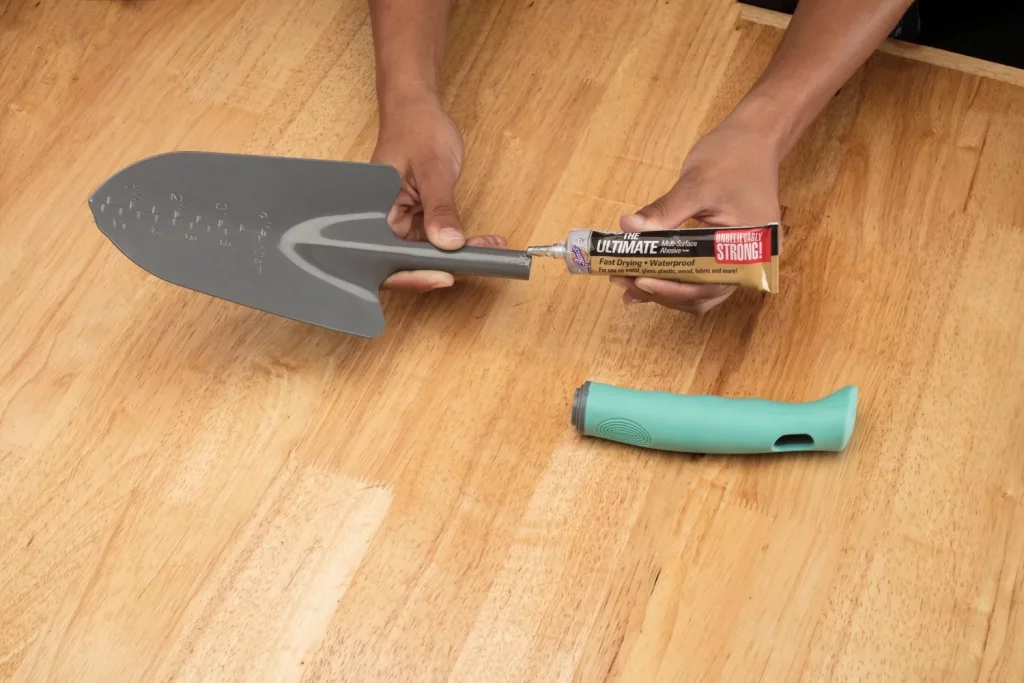man gluing shovel to show the best glue for metal to plastic 